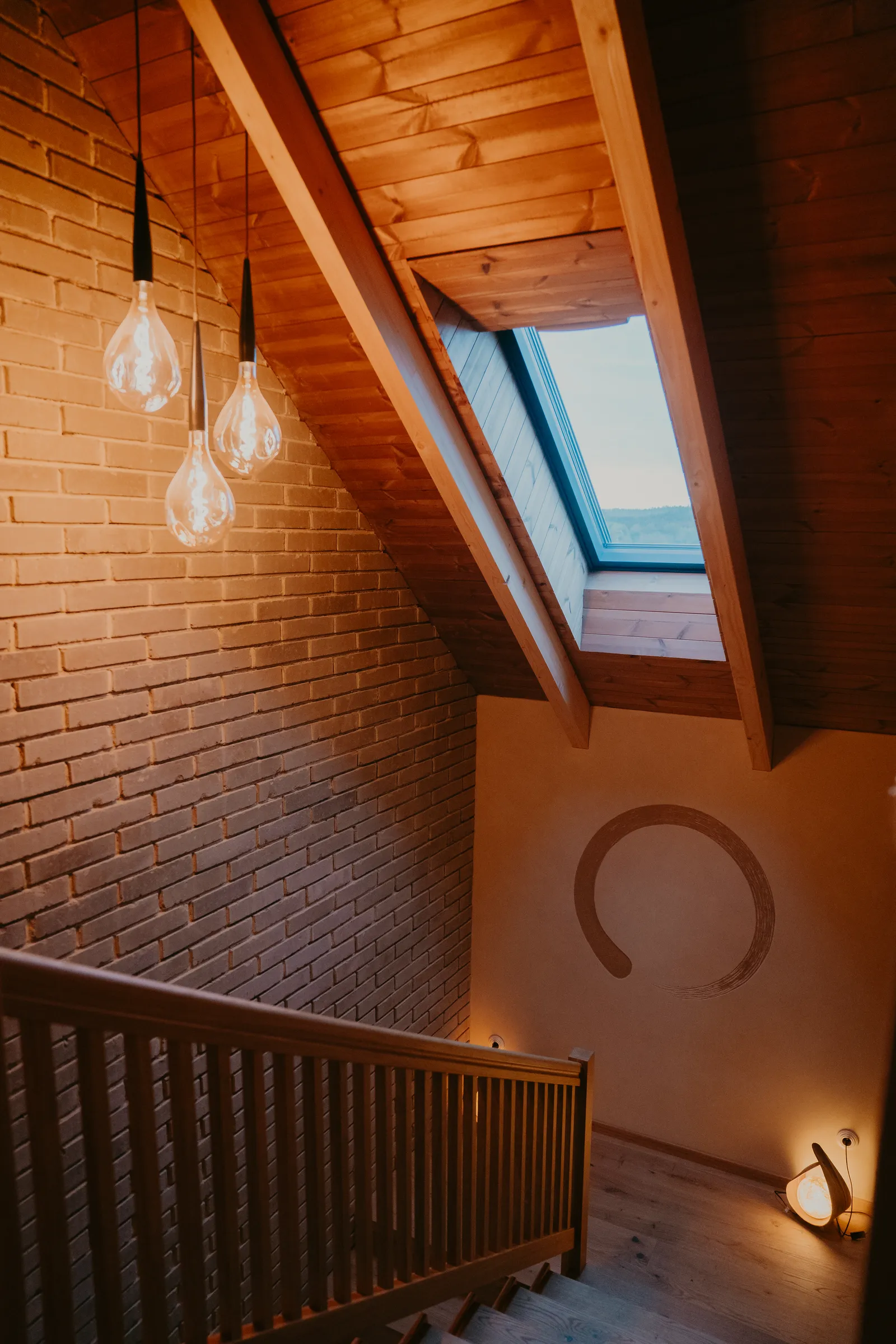 a stairwell with a brick and clay wall